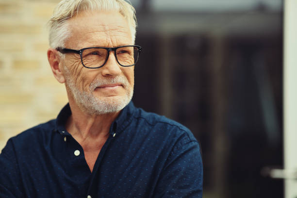 istock Content senior man standing outside in his yard 969571340