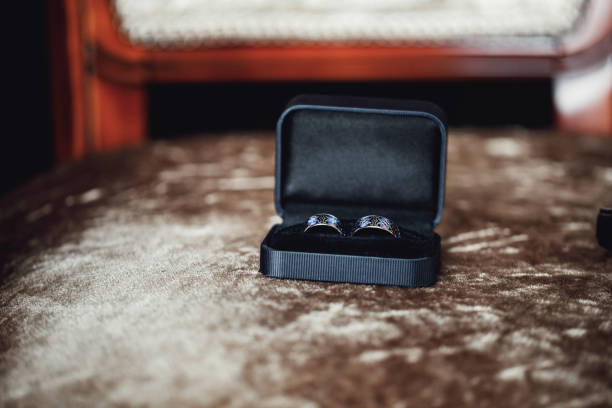 istock Wedding rings on a blue background. Wedding details. 969571774