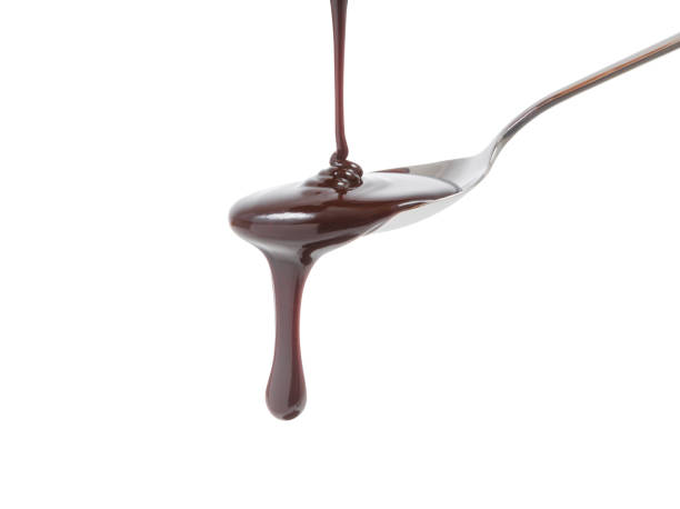 istock chocolate syrup pouring on spoon, cooking, baking 969572014