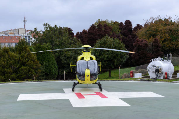 istock yellow helicopter on helipad 969572156