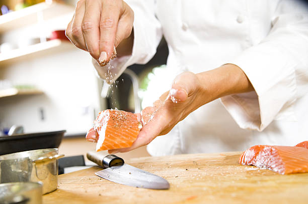 istock Seasoning and Preparing Raw Salmon 96957429