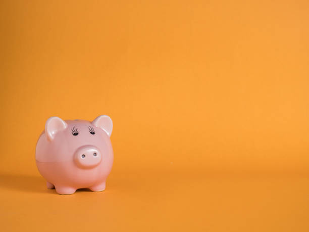 istock piggybank on yellow backgrounds 969574548