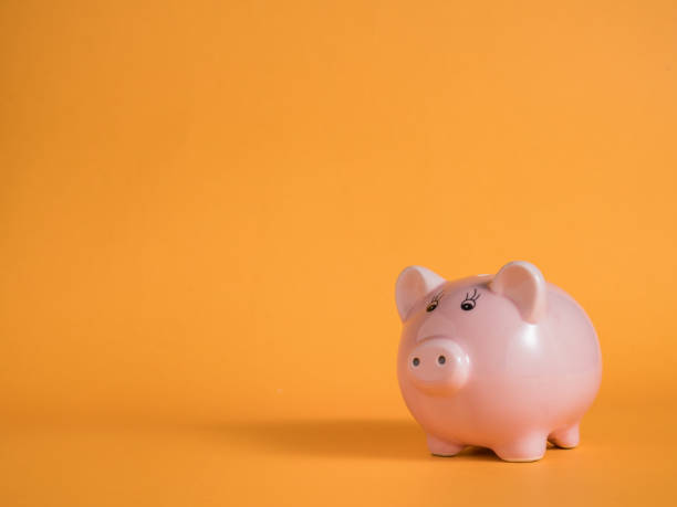 istock piggybank on yellow backgrounds 969574576