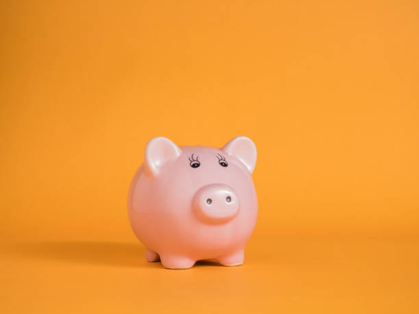 istock piggybank on yellow backgrounds 969574592