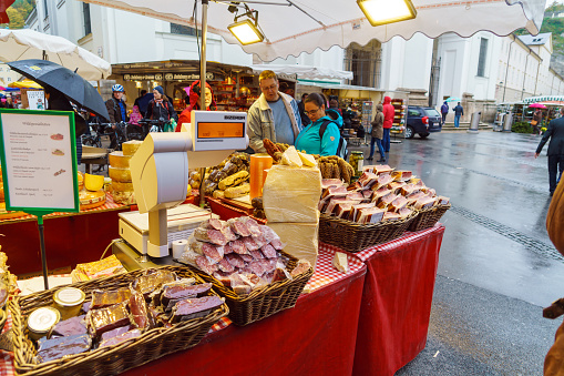 Salzburg, Austria - October 21, 2017: Street trade in sausages, dried meat, cheese and other local food products in the old town