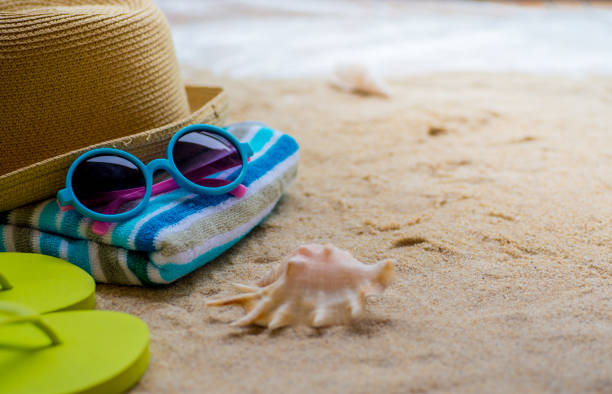 Beach Accessories On Table On Beach - Summer Holidays