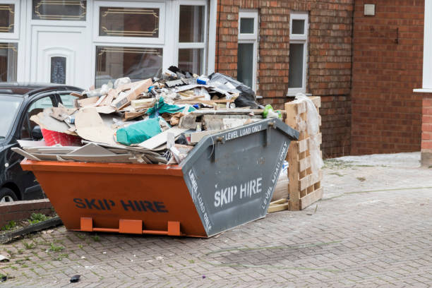 Street side skip filled with rubish stock photo