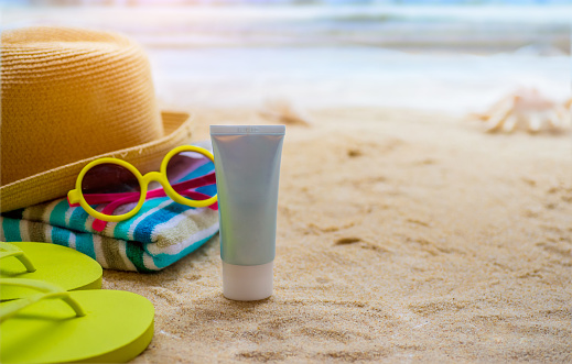 Beach Accessories On Table On Beach - Summer Holidays
