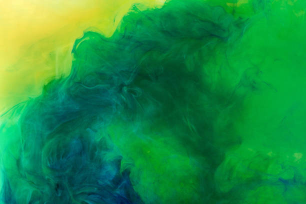 istock artistic texture with green paint flowing in water 969584666