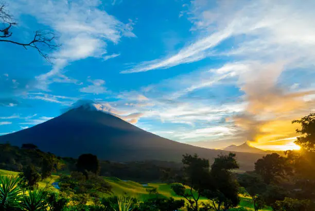 Photo of Agua volcano sunrise in Guatemala, golf club La Reunion. 3,760 m. Central America. Nature reserve attractive landscape tourism.