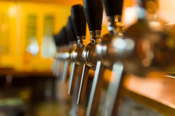 istock Beer taps on bar counter, brewpub. 969591482