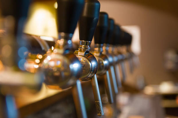 istock Beer taps on bar counter, brewpub. 969591770