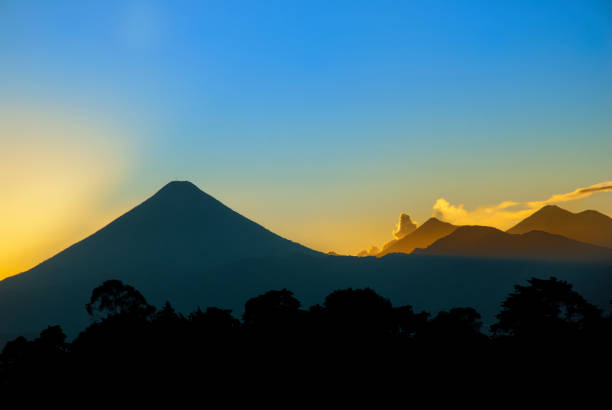 istock Dramatic sunset in Guatemala, volcad called Agua, colorful sky, Central America. 969595470