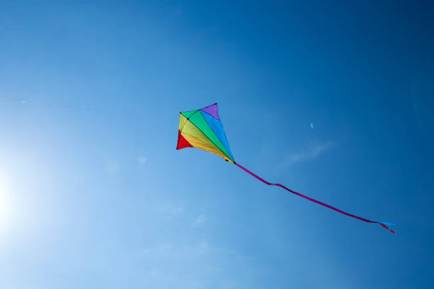 istock Kite flying in the sky among the clouds 969596028