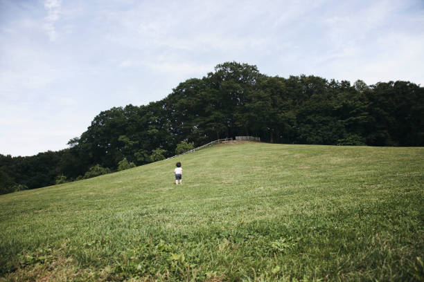 Asian boy playing in the park.