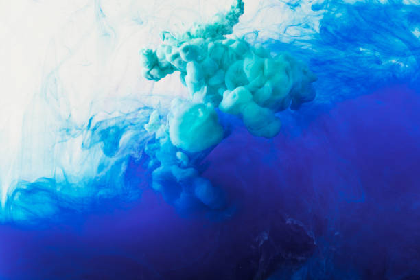 istock abstract background with flowing blue and turquoise ink in water 969603638