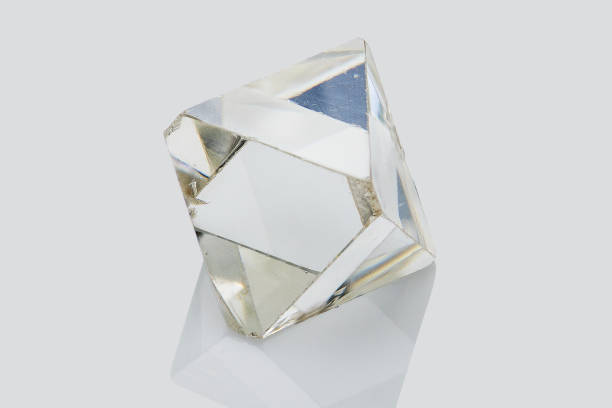 istock Transparent rough diamond isolated on white background 969604944