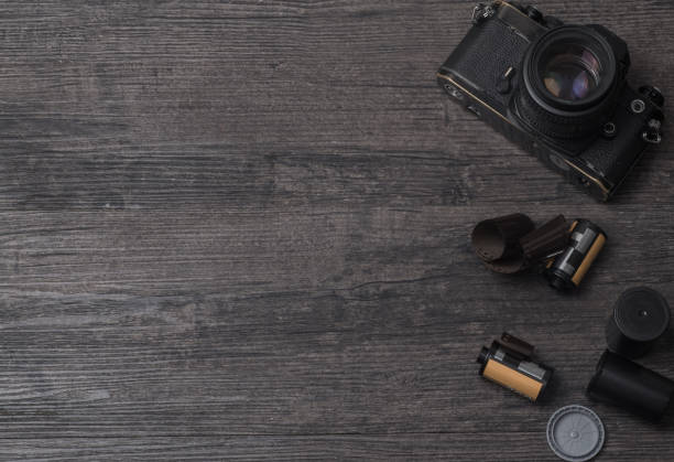 istock Retro camera and film on the desktop 969605008