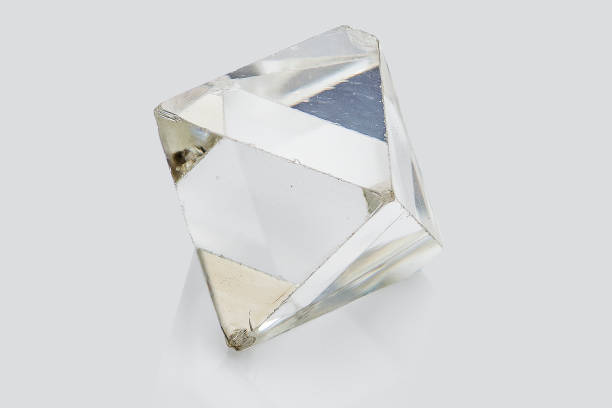 istock Transparent rough diamond isolated on white background 969605084