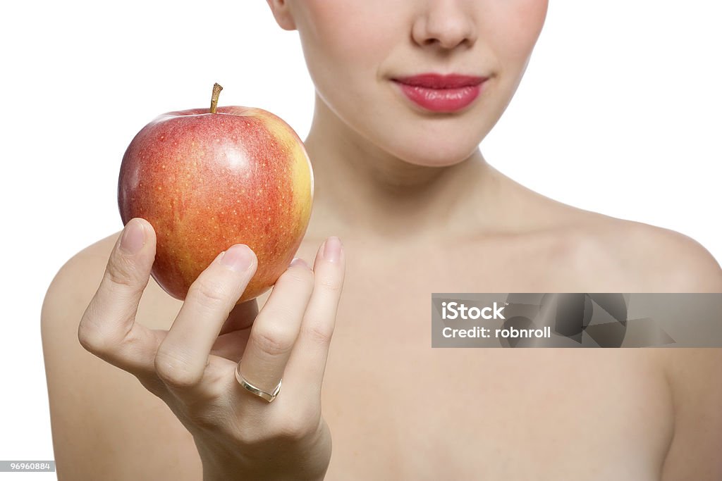 Schöne junge blonde Frau mit roten Apfel - Lizenzfrei Abnehmen Stock-Foto