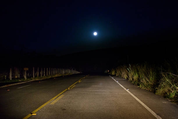 Traveling on a lonely road in the moonlight.  Minas Gerais, Brazil.
