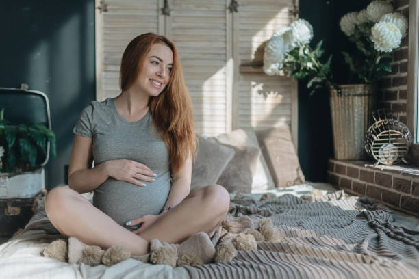 istock Pregnant woman dreaming 969614078
