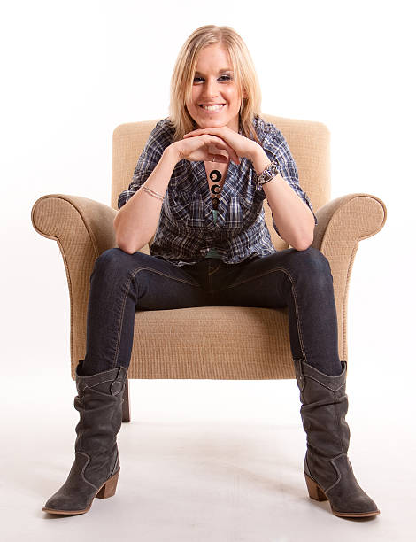 istock Smiling girl on an armchair 96962075