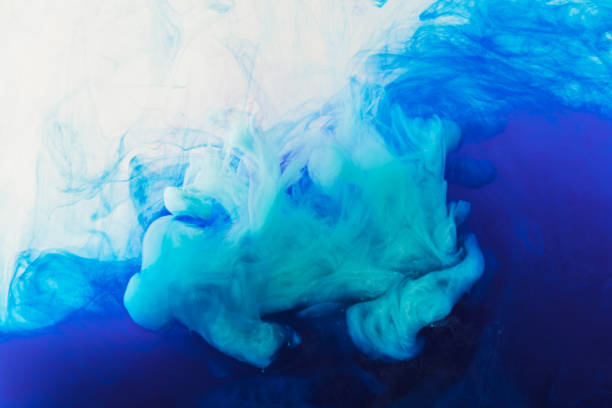 istock abstract texture with flowing blue and purple paint in water 969621432