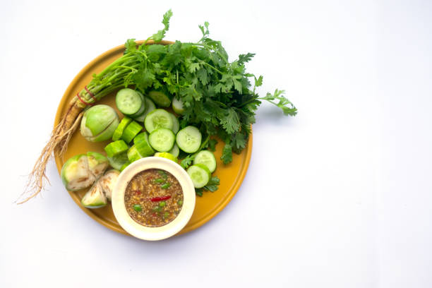 istock Shrimp paste sauce (nam prik kapi) served with mix vegetable on yellow dish 969623600