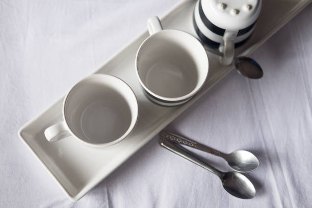 istock Empty cup for hot coffee and tea on soft and comfortable bed 969623730
