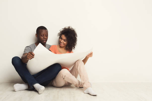 istock Black sitting on floor in new apartment 969623902