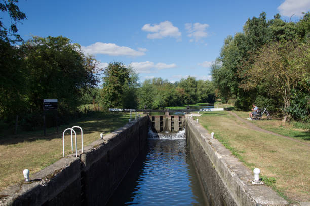 Feakes Lock on River Stort Harlow, Essex, England - 8th September 2016: Lock on Lee & Stort canal near Pishobury Park, Sawbridgworth a place for a break while cycling. harlow essex stock pictures, royalty-free photos & images