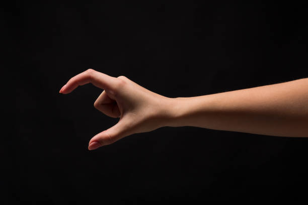 istock Female hand measuring something, cutout, gesture 969625036