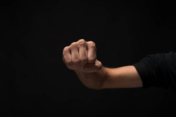 istock Hand gesture, man clenched fist, ready to punch isolated 969625514