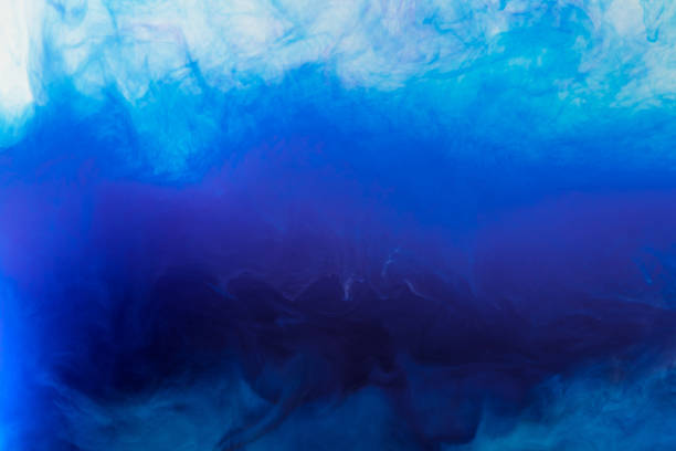 istock artistic background with flowing blue smoky paint in water 969628828