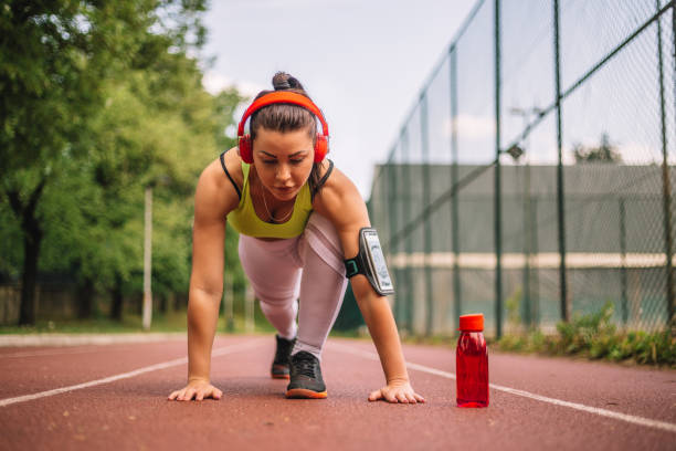 istock Athlete prepares for a morning jogging on the track running 969629064