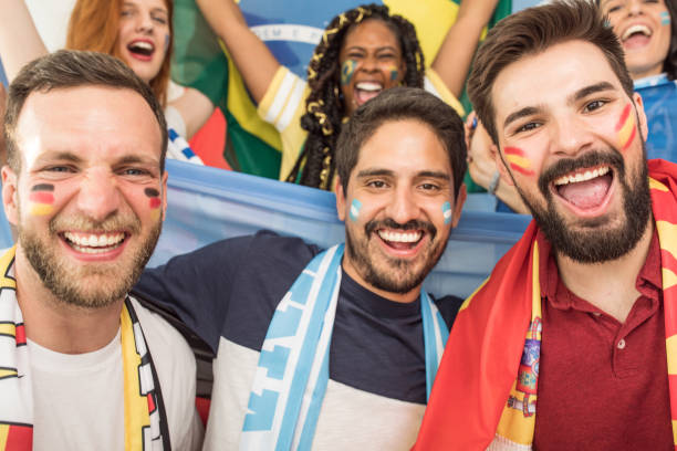 istock Soccer fans cheering for national teams 969629704