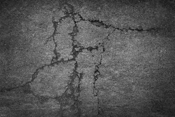 istock Crack background texture of rough asphalt 969632922