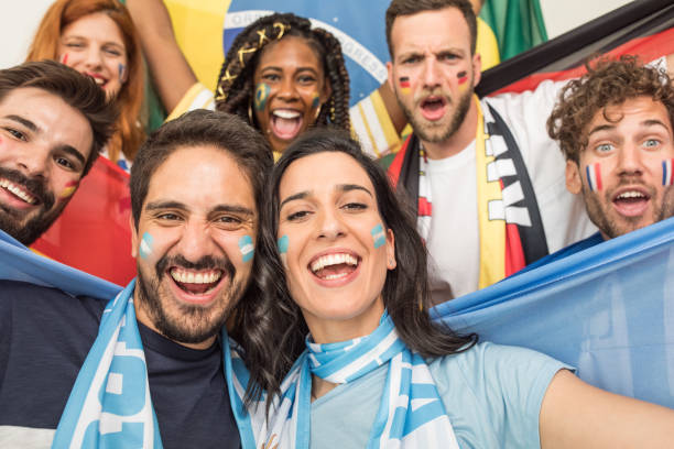 istock Soccer fans cheering for national teams 969632948