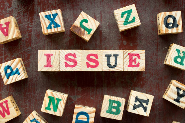istock Letter block in word issue with another on old red wood background 969635210