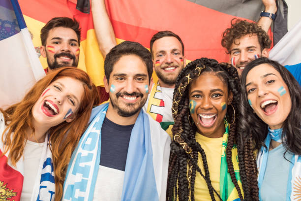 istock Soccer fans cheering for national teams 969635220