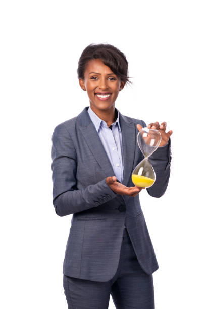 reloj de explotación de mujer de negocios. - businesswoman black african descent studio shot fotografías e imágenes de stock