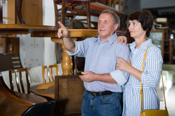 istock Ordinary couple is shopping the old table 969641714