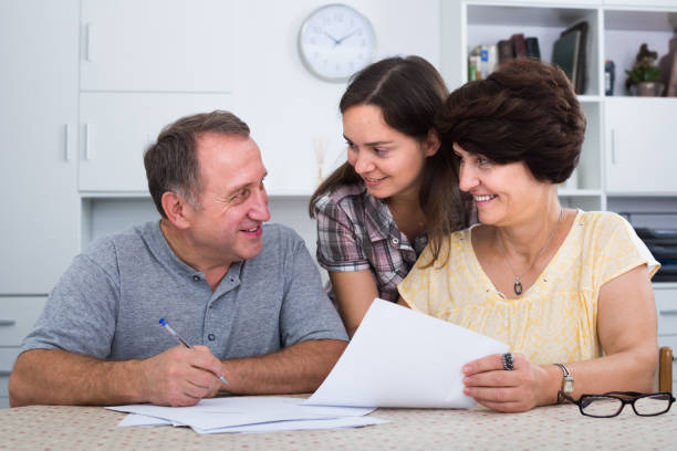 istock Man and woman signing documents 969645752