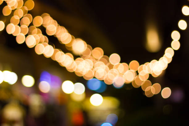 istock Blur - bokeh Decorative outdoor string lights hanging in the festivals and parties 969649014