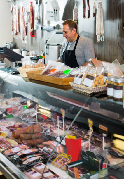 istock butcher with smoked meat 969649496