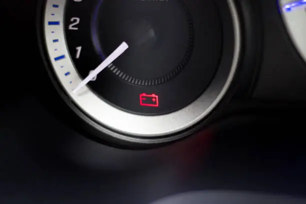 Close up - Low battery warning light in-car dashboard