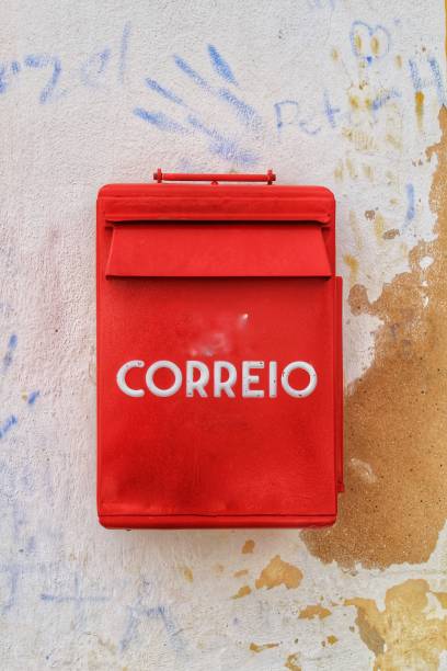 istock Colorful metallic mail box in red color on wall with old paint 969653450
