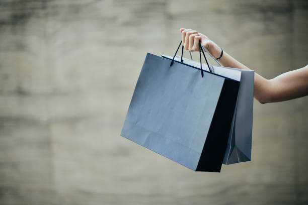 istock Hand holding shopping bag. 969653850