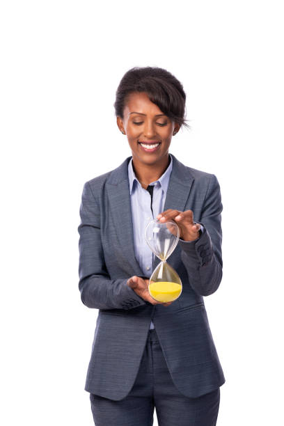 reloj de explotación de mujer de negocios. - businesswoman black african descent studio shot fotografías e imágenes de stock